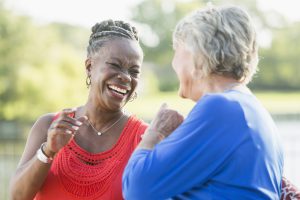 Senior multi-racial women, best friends,  laughing